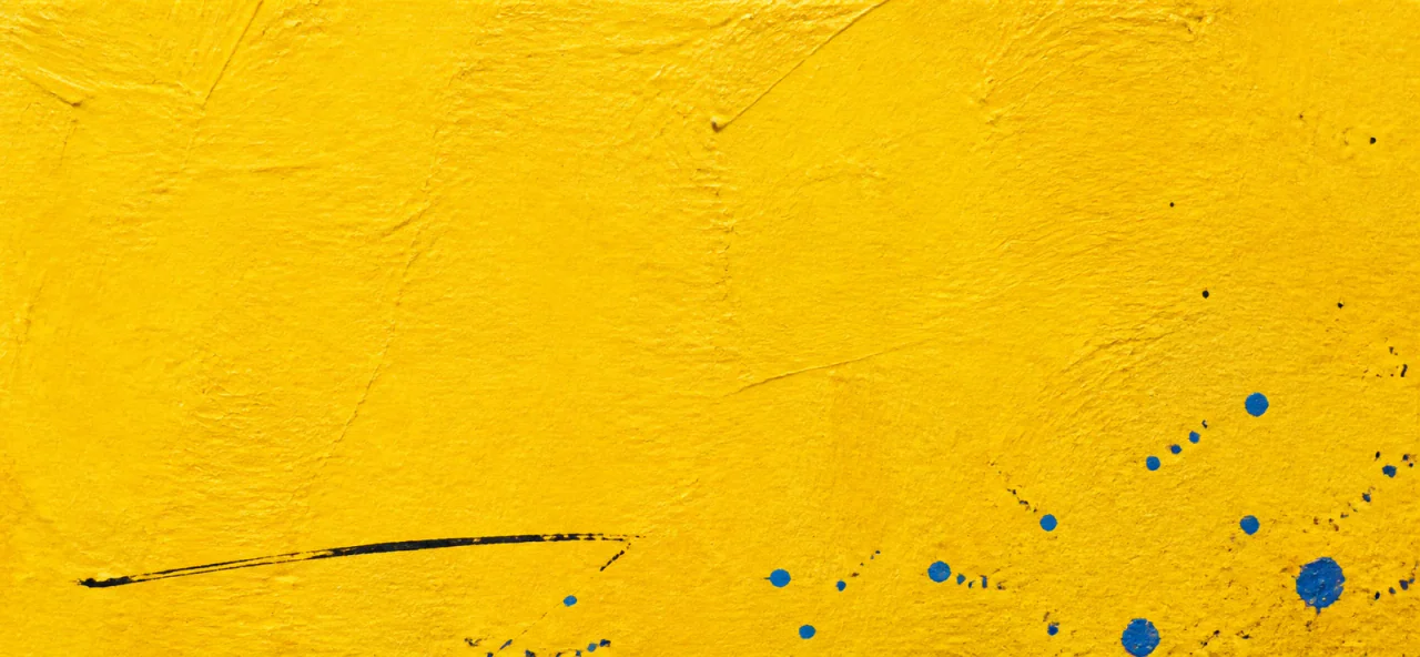 A sunflower-yellow painted paper note with black hand-drawn lines and cobalt paint droplets.